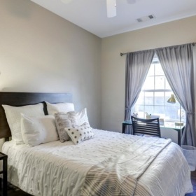 Make this space your own  a bedroom with nightstand and lamp