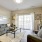 living room with large windows and a couch