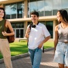 a group of students walking outside with their backpacks